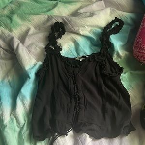 Cute black tank with lace in the middle and fun straps
